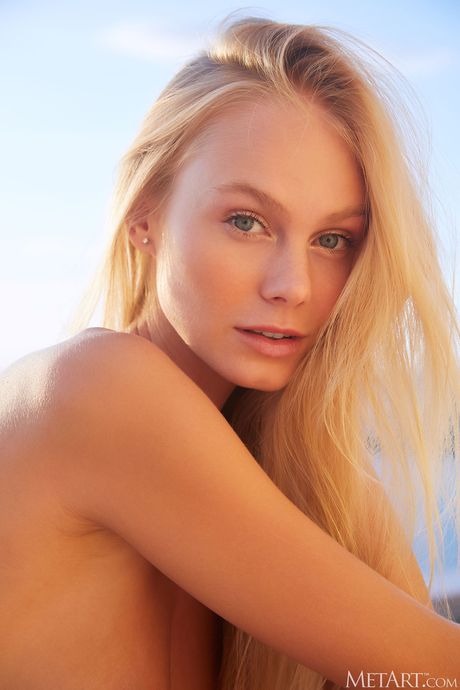 Ukrainian babe Nancy A strips off her bikini and demonstrates her big tits