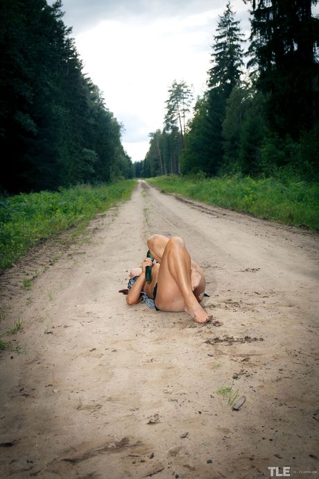 Lola Ash strips outdoors and masturbates with a huge zucchini