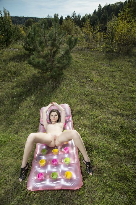 Sexy brunette Serena shows off her tiny tits and her shaved pussy