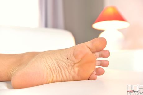 Sexy brunette Lorena shows off her hot feet and toes in a solo