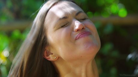 Hot lesbians Talia Mint and Alyssa Reece have sex with a strap-on dildo in the backyard