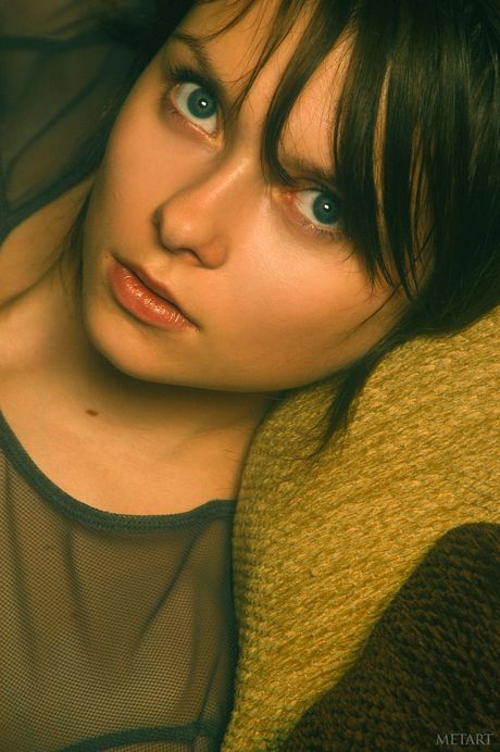 Intriguing teen Anna S removes her lingerie and boots to pose nude