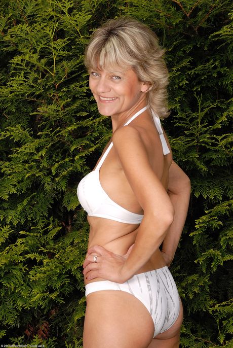 Mature granny Sherry D shows her big ass and touches her pussy outdoors