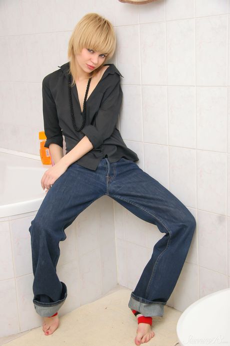 Young blonde Cindy B gets naked in leg warmers while taking a bath