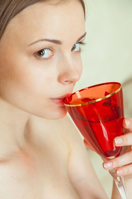 Skinny blonde teen Winnie exhibits her small tits and poses naked