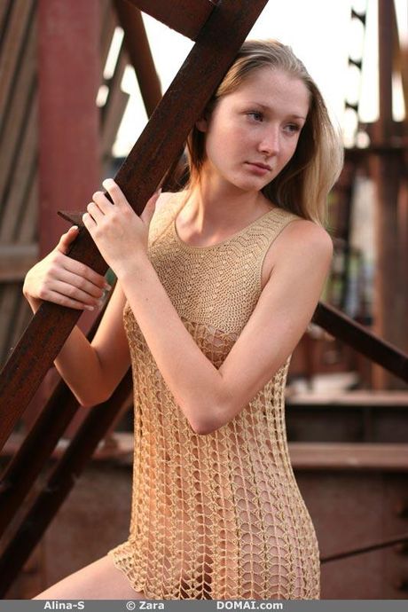 Delicate teen Alina S shows her small tits and poses nude in a solo