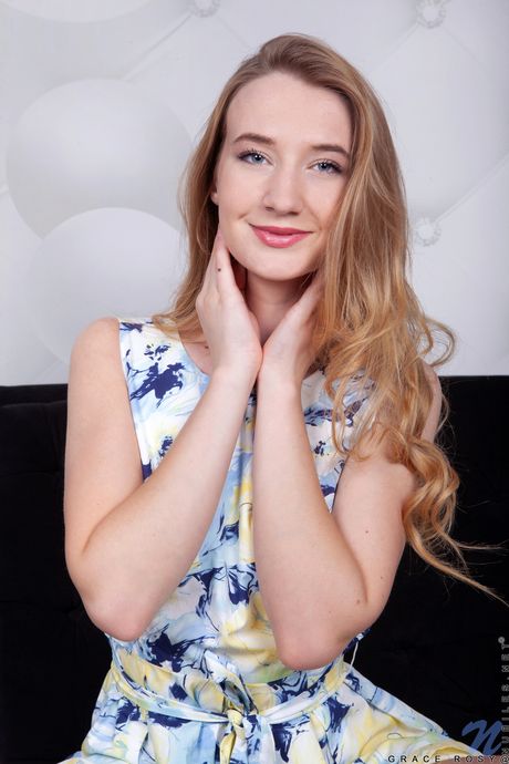 Ligh-haired teen Grace Rosy removes a dress and heels to model in the nude