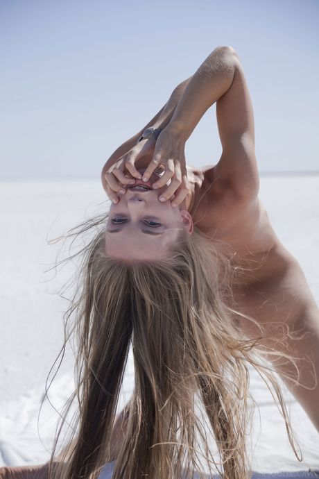 Magnetic teen Milena D strips naked and masturbates on a salt flat