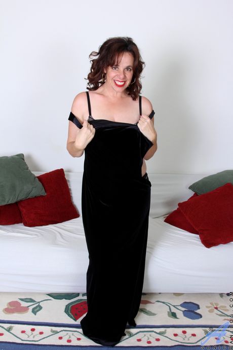 Redheaded MILF Sonic removes her dress and lingerie to pose naked
