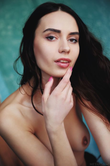 Cute teen Dita V removes her lingerie and panties to pose nude on her bed