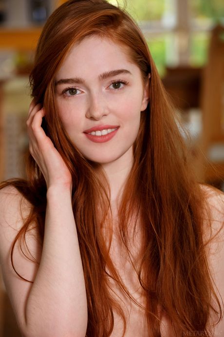 Sexy redhead Jia Lissa gets naked without shyness during a solo