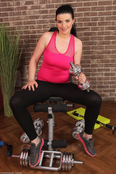 30 plus female Sandra Nero goes naked while doing yoga in her home