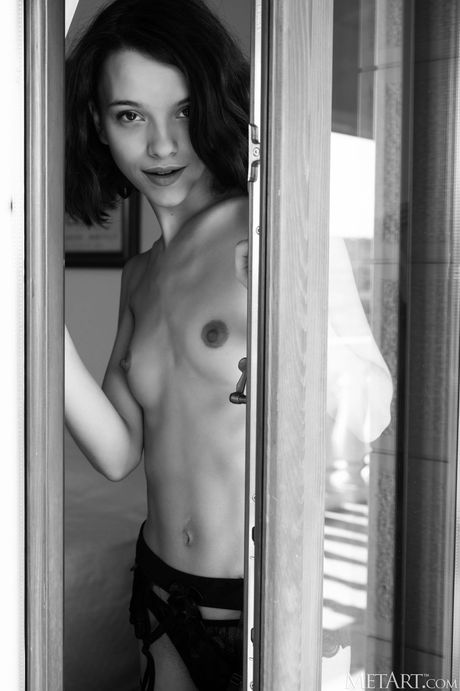 Angelic teen Ohana removes her lingerie and stockings to get naked