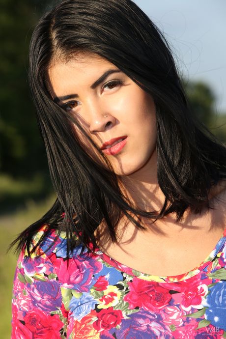 Lean teen Lady Dee takes a piss in a field while wearing high heels