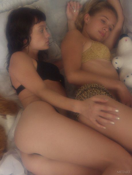 Petite teen girl with long hair and a nice ass poses naked in the nude