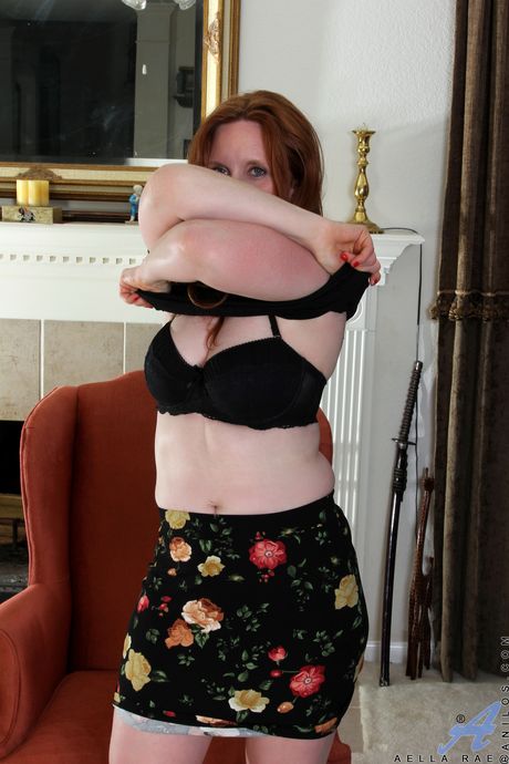 Redheaded amateur Aella Rae removes a black dress and a pair of panties