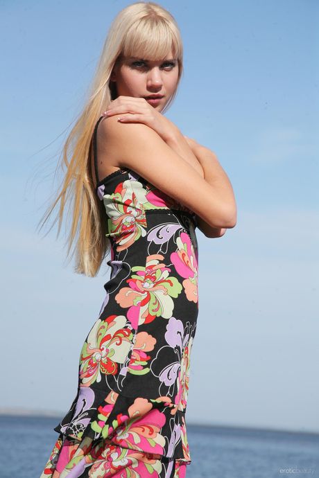 Lean teen Eveline shows her small tits and poses nude in a solo