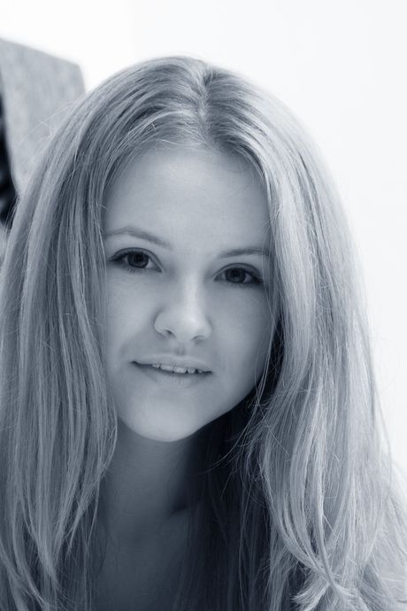 Sexy redhead Alice May gets naked in socks and sunglasses on a vacation