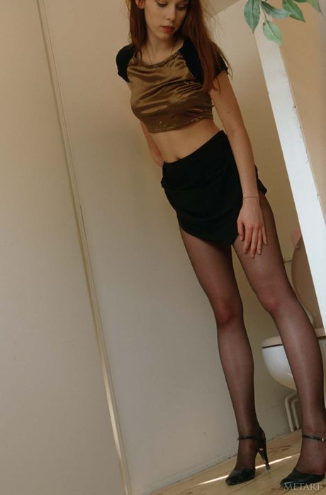 Pretty teen girl with a hot ass gets naked in a bathroom