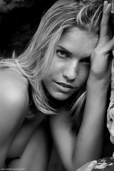 Precious teen girl with long hair and a tight ass poses nude in heels