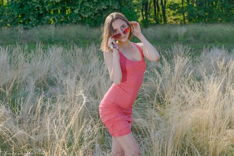 Young brunette Zhy Zhy bares her body on a blanket in a field