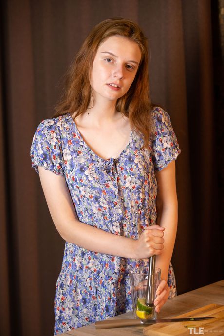 Petite teen Sienna removes white bra and panty set to pose nude in kitchen