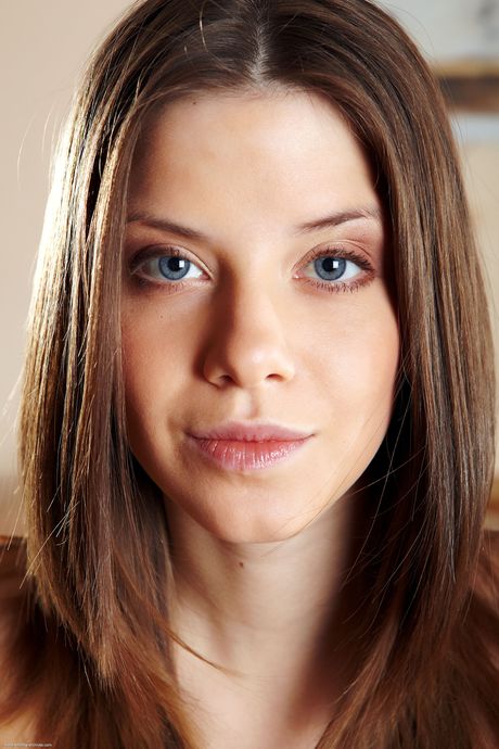 Petite teen Anita highlights her perfect ass while naked on a bed