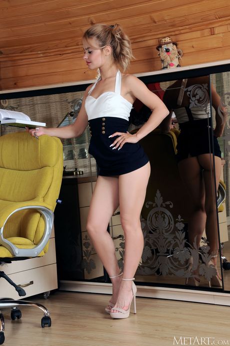 Young blonde Lana Foxy goes naked fearlessly on a desk