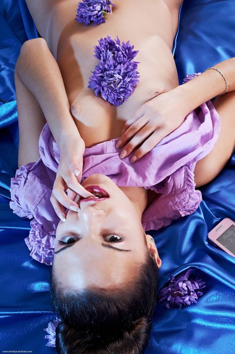 Svelte teen Romy shows her small tits and hot ass in a solo striptease