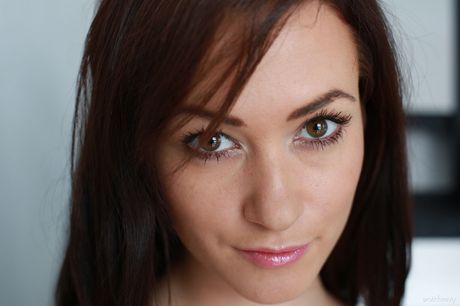 Tess Lyndon reveals her big tits and hot ass as she poses on the stairs