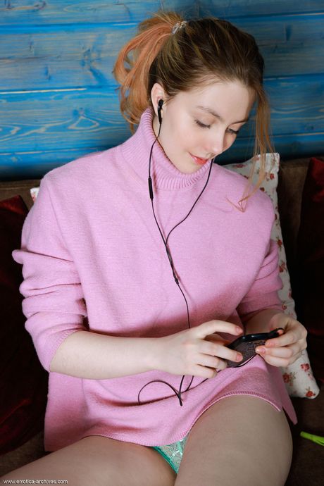 Adorable teen Rita removes her underwear to get completely naked