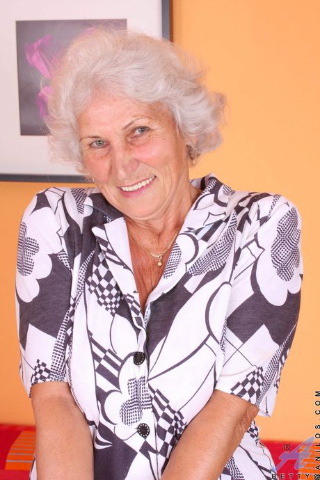 Mature granny Norma shows her big tits and masturbates in stockings