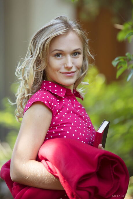 Lovely teen Aislin removes her bikini before fingering her pussy on a bench