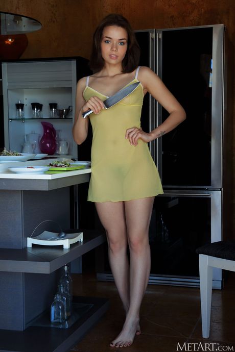 Delightful teen Keira Blue bares it all while chopping veggies in a kitchen