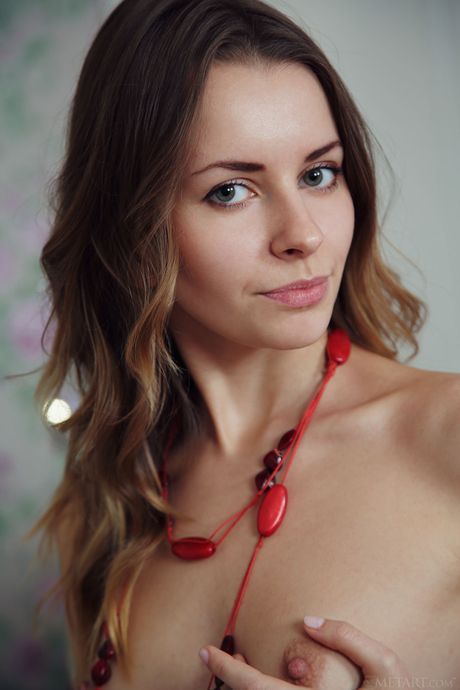 Tempting teen Lucia D removes her bikini and panties to pose nude