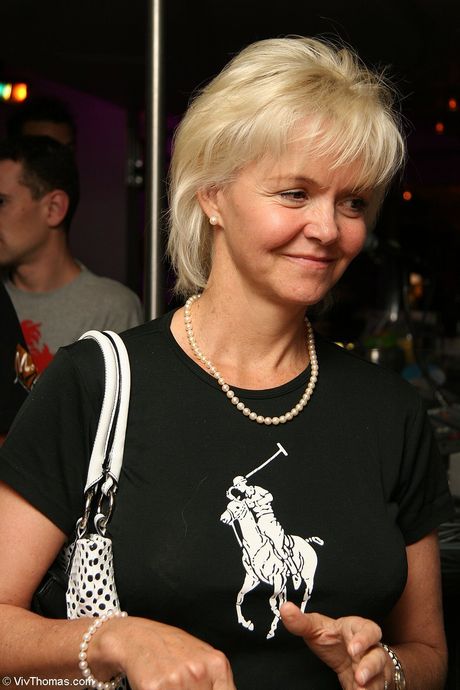 Intriguing teen Sophie Moon smokes a cigarette while posing nude in a field