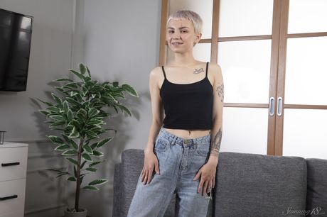 Bramble Bee exhibits her tiny tits and shaved pussy in a solo