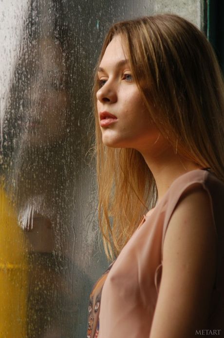 Blonde teen Anna X removes her dress and flaunts her small tits outdoors