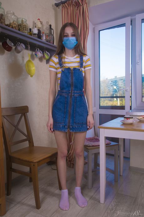 Skinny blonde teen Lia fingers her pussy while naked in socks