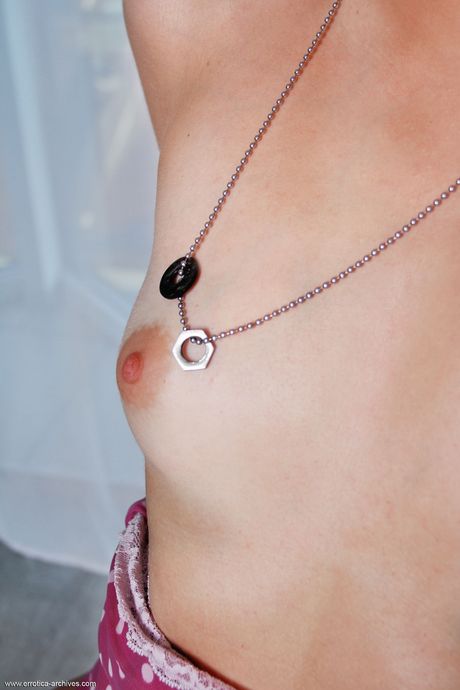 Liuba takes off her black lingerie and sneakers and poses naked on the stairs