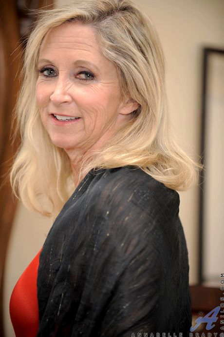 Blonde granny Ann Brady masturbates with a vibrator in her high heels