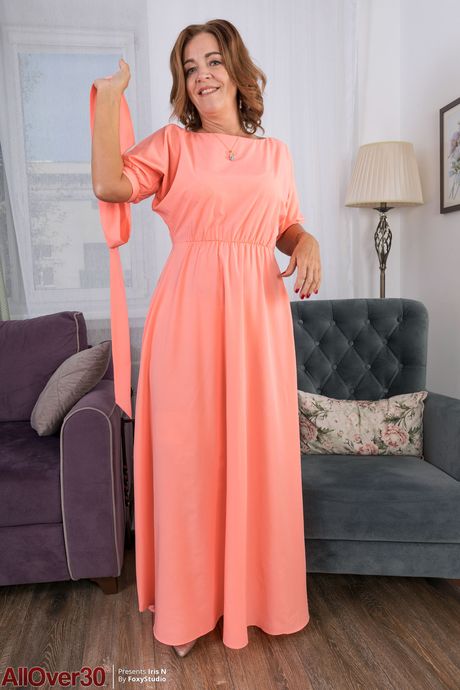 Mature redhead Iris N shows off her big ass & her hot feet in stockings