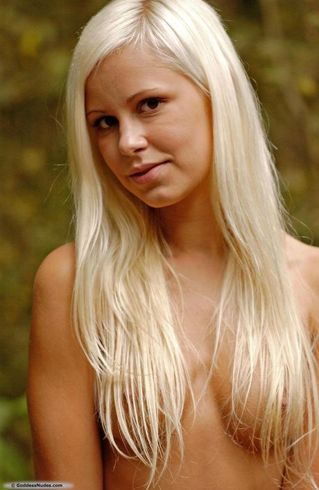 Blonde teen Dido A takes it all off on a patio in sandals