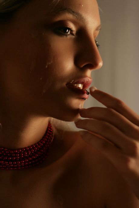 Lean teen Kira W removes her lingerie and heels to pose nude in candlelight