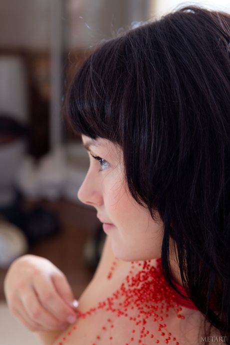 Tempting teen Mirelle A removes her bikini to pose nude