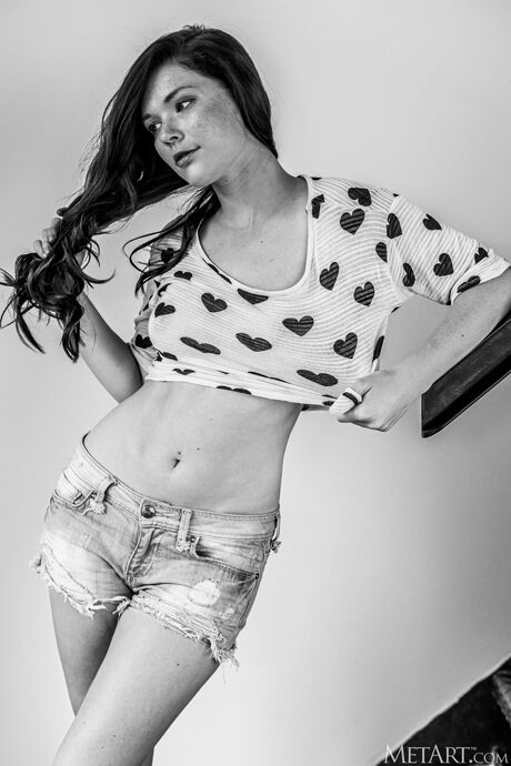 Redheaded teen Mia Sollis gets naked confidently