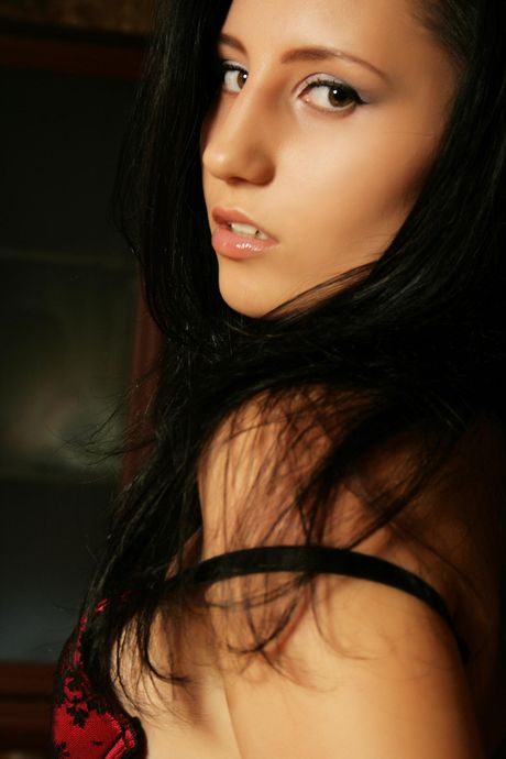 Angelic teen Kitty M removes her lingerie to pose nude in stockings