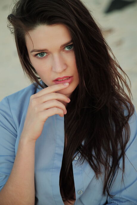 Skinny Ukrainian peach Serena Wood shows her big tits and poses naked on the beach