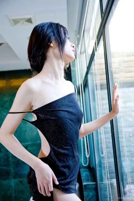 Charming Asian teen Willy strips and poses naked in high heels