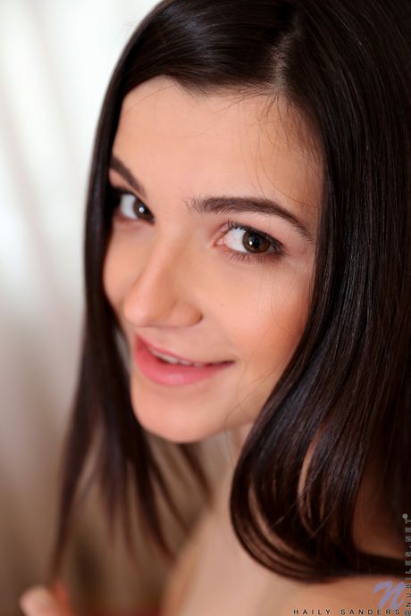 Petite teen Haily Sanders strips and fingers her pussy in a solo